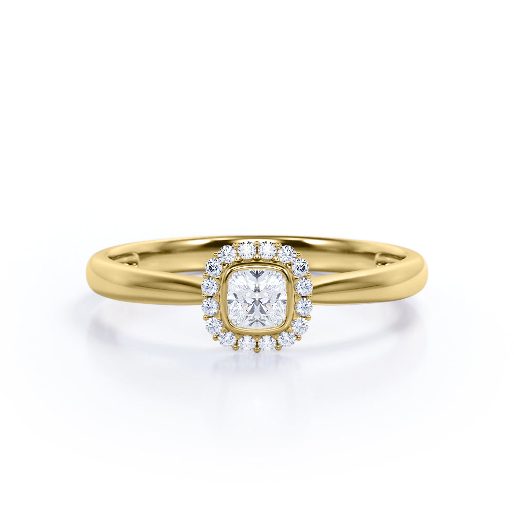 Halo solitaire 0.6 carat Cushion cut Moissanite and diamonds pinched shank engagement ring in yellow gold