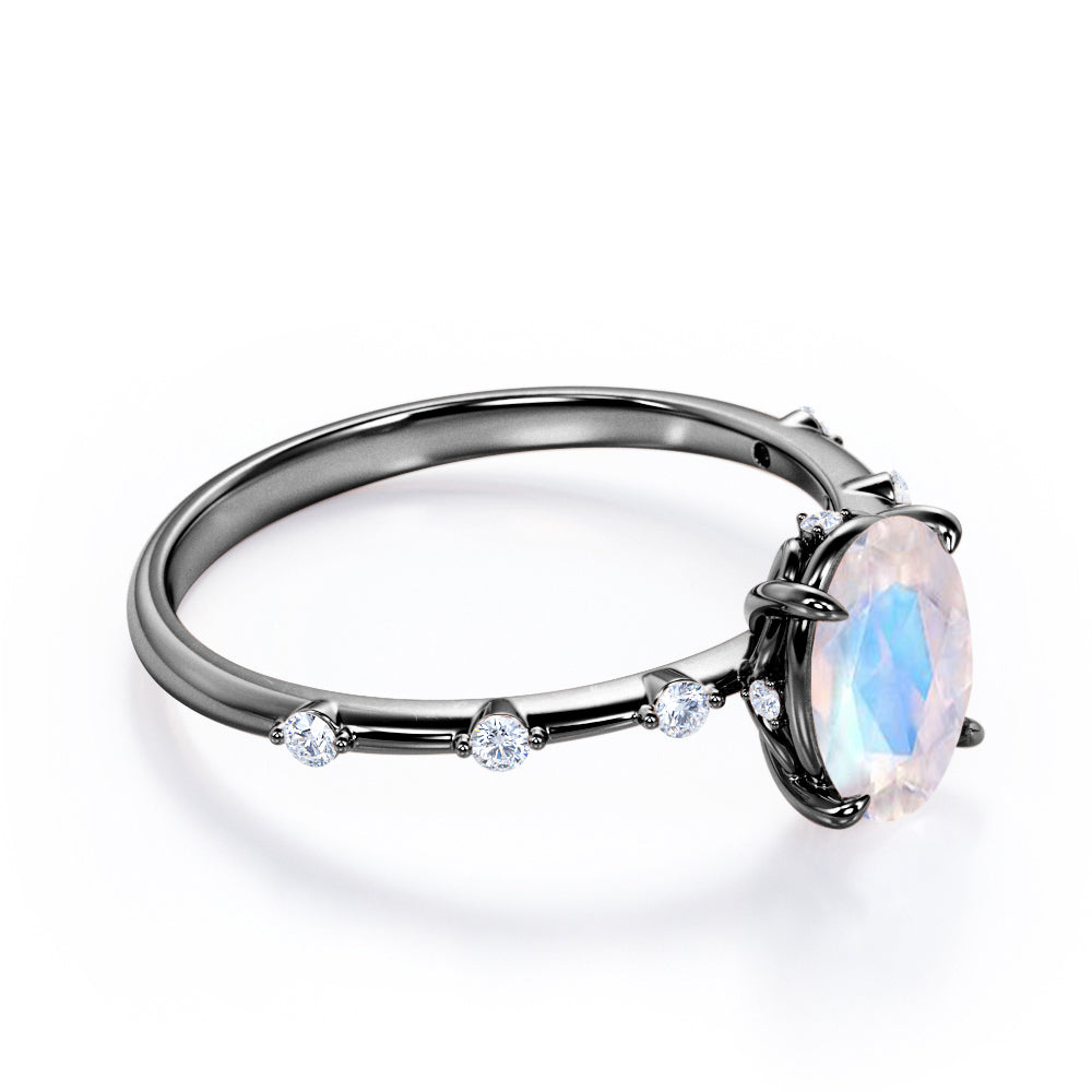 Branch Twig 1.1 carat Oval shaped Moonstone and diamond dainty engagement ring in Black gold