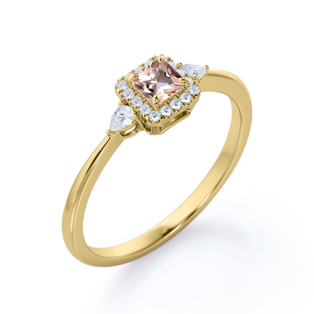 Exquisite three stone 0.75 carat Princess cut Peach Pink Morganite and diamond tapered style anniversary ring in Yellow gold