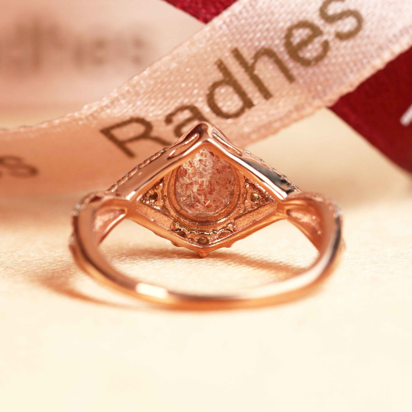 Half Halo 1.25 carat Pear Cut Strawberry Quartz and Diamond Semi-mount Twisted Shank Wedding Ring in Rose Gold