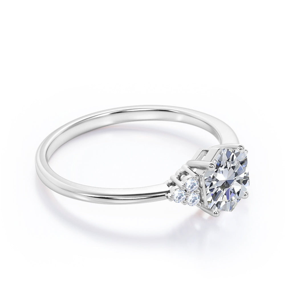 Modern 1 carat Hexagonal Moissanite and diamond tapered knife edge engagement ring in White gold