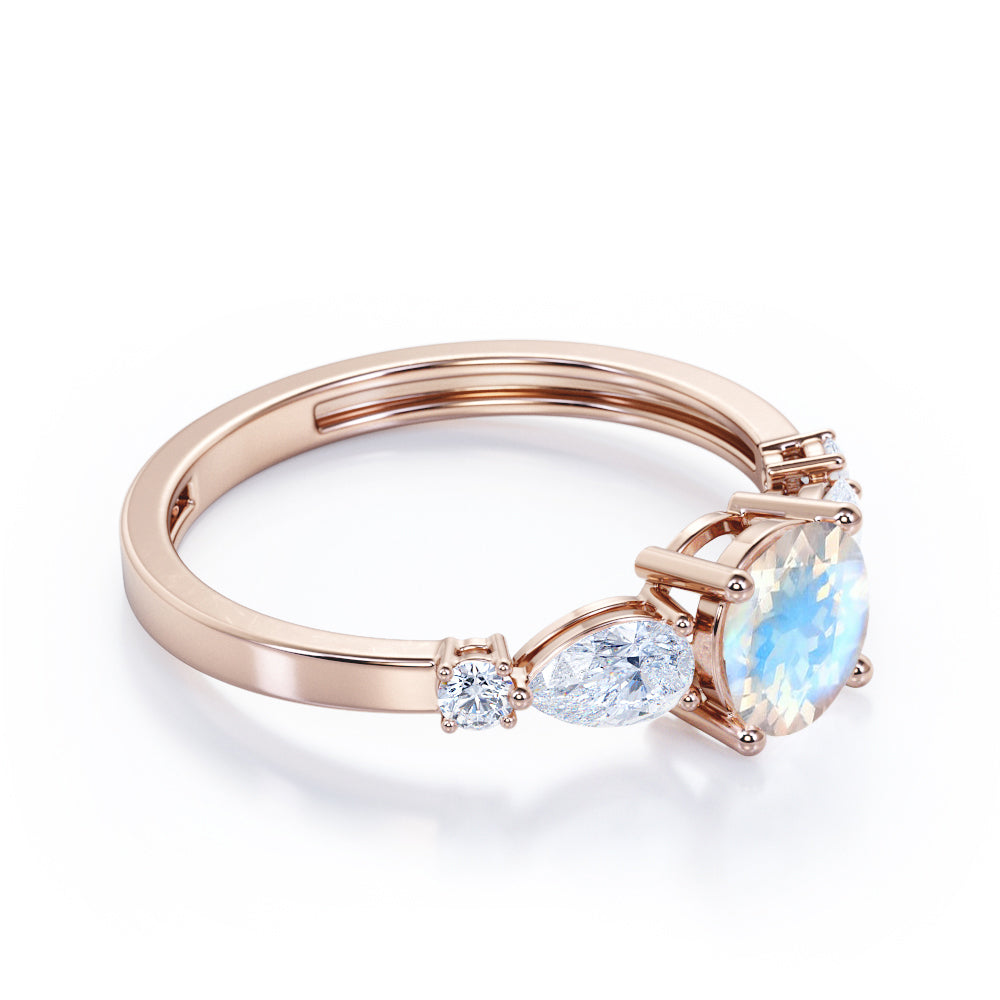 Modern 1.15 carat Round cut Blue Moonstone and diamond marquise 5 stone engagement ring in Rose gold