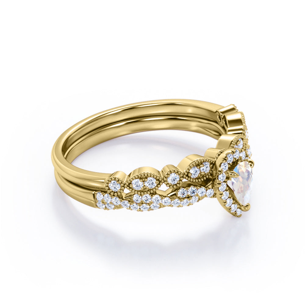Art deco Milgrain 1.65 carat Pear cut Moonstone and diamond twisted pave engagement ring in yellow gold