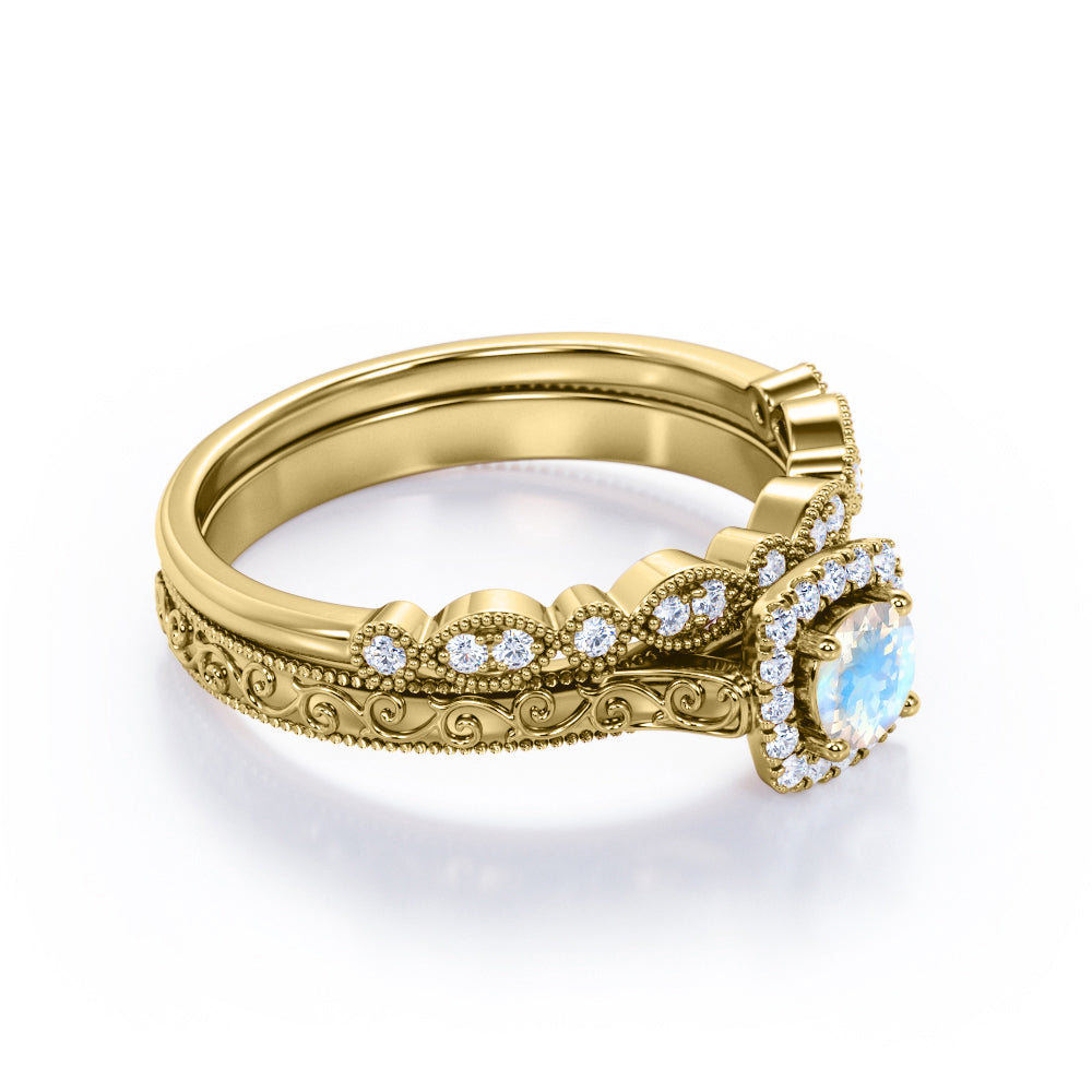 Antique Filigree and Milgrain 1.5 carat Round cut Moonstone and diamond square halo engagement ring in yellow gold