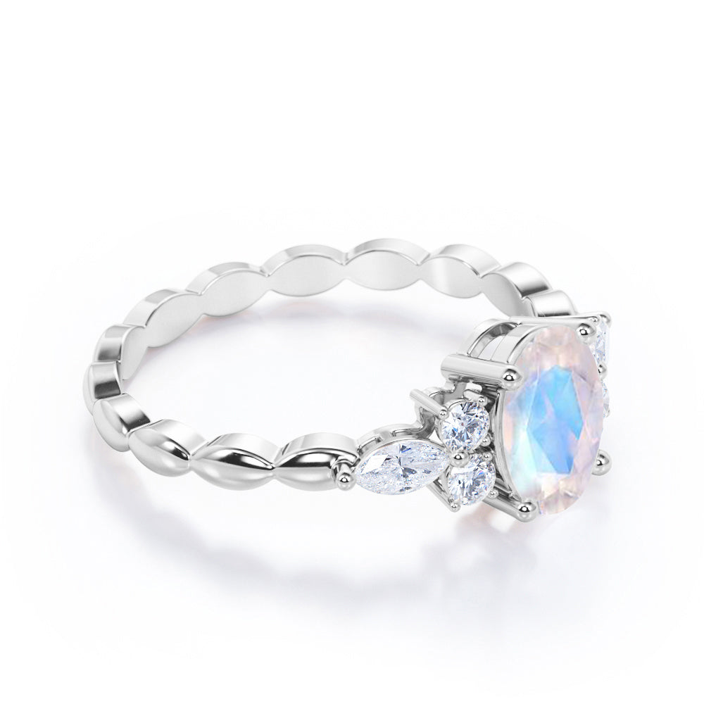 Scalloped Rope Design 1.15 carat Oval cut Moonstone and diamond 7 stone engagement ring in White gold