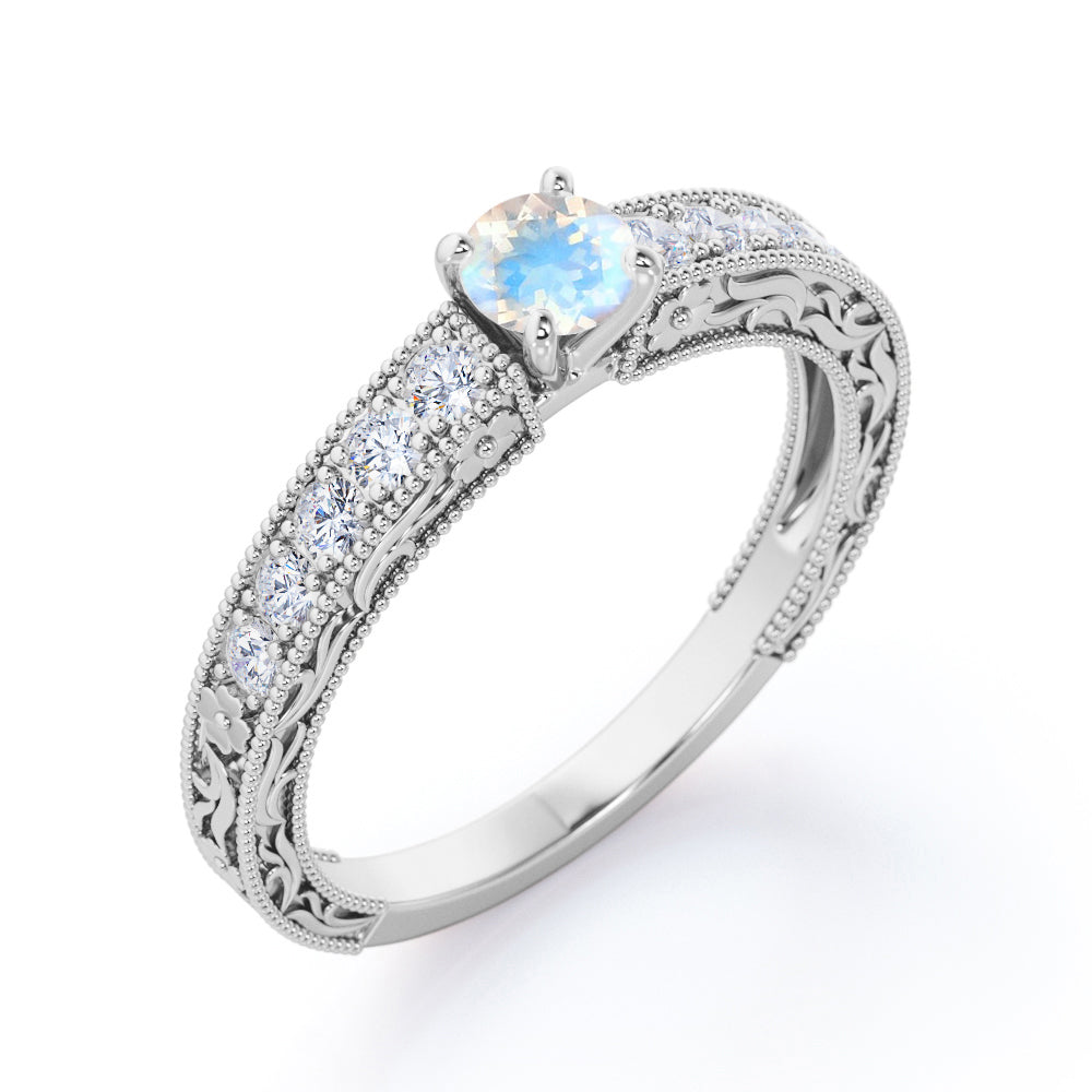 Art deco Cathedral 1.25 carat Round cut Blue Moonstone and diamond Milgrain and Filigree engagement ring in White gold