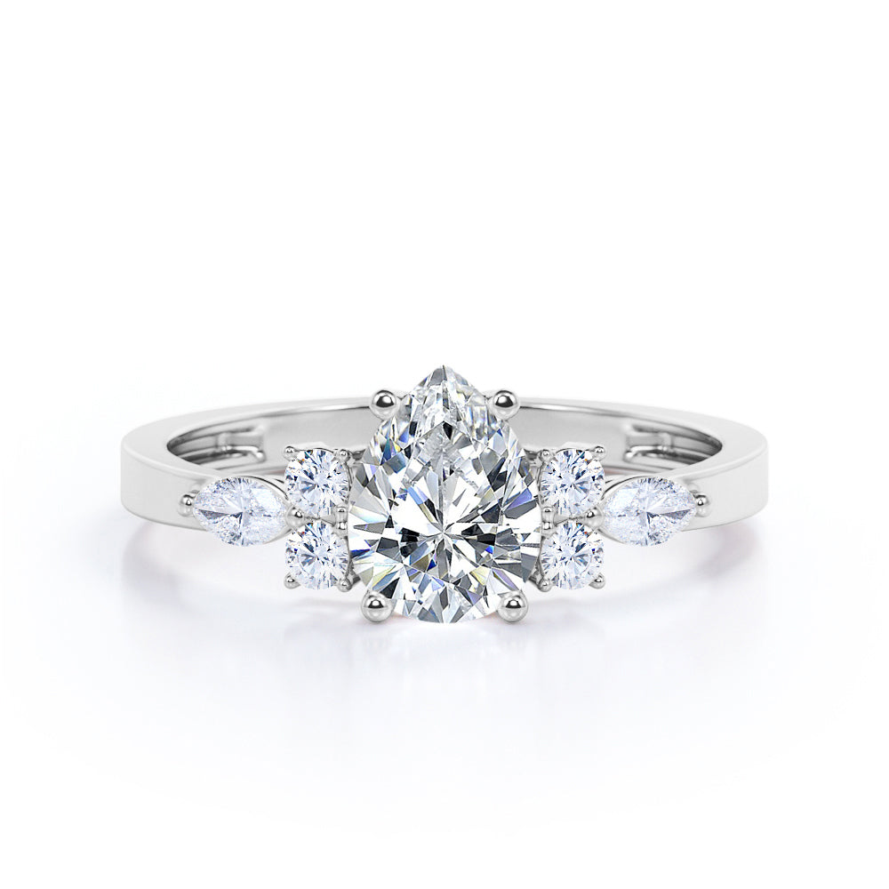 Elegant Beveled Edge 1.15 carat Pear cut Moissanite and diamond engagement ring in White gold