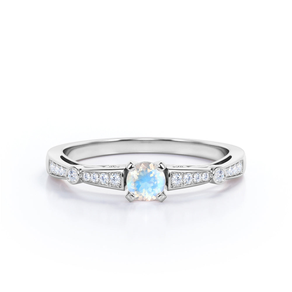 Basket set 1.25 carat Round cut Blue Moonstone and Diamond tapered shank engagement ring in Yellow gold