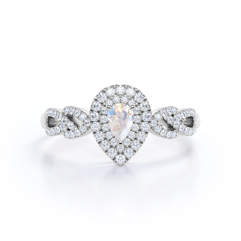 Intertwined 1.7 carat Pear shaped Blue Moonstone and diamond twisted infinity halo engagement ring in White gold