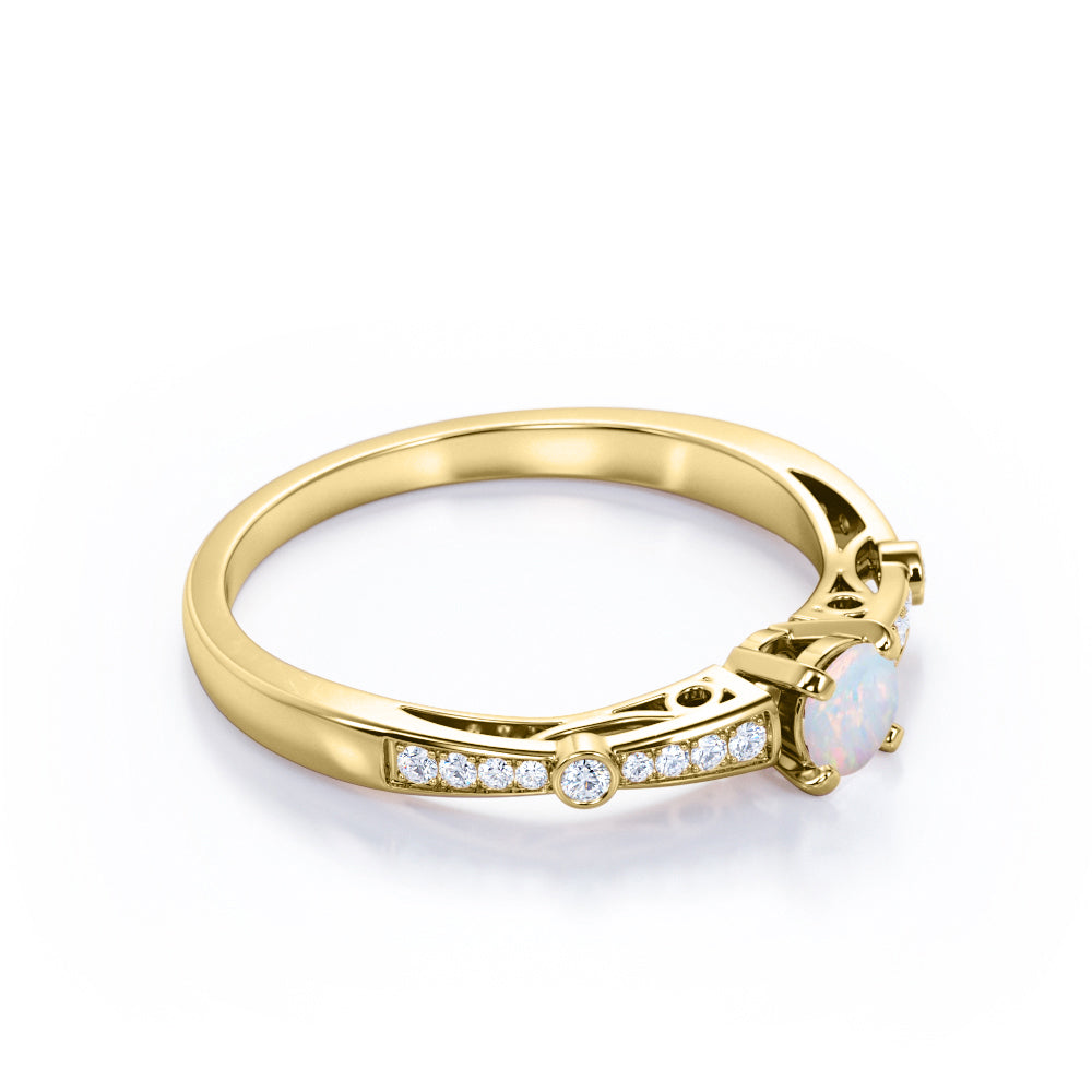 Artistic 0.66 carat Round cut Natural Ethiopian Opal and diamond art deco style engagement ring in Yellow gold