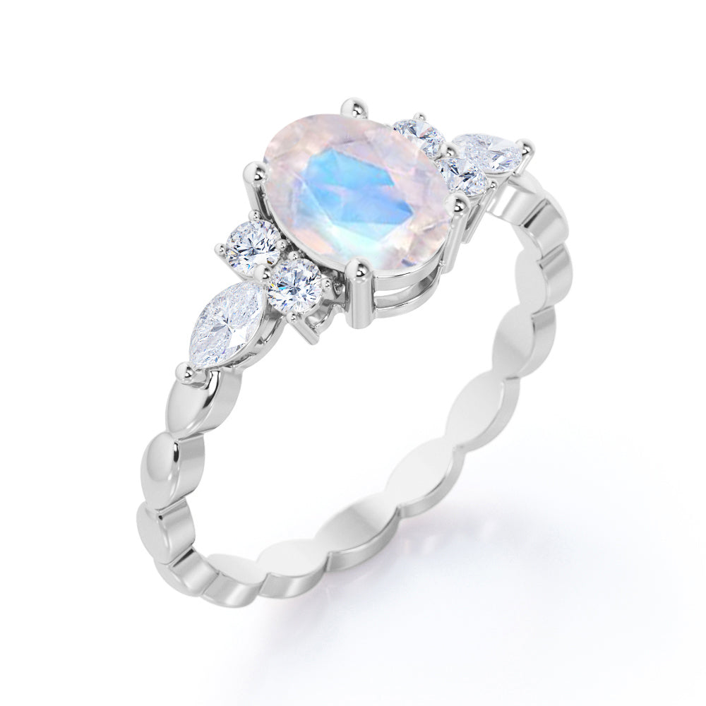 Scalloped Rope Design 1.15 carat Oval cut Moonstone and diamond 7 stone engagement ring in White gold