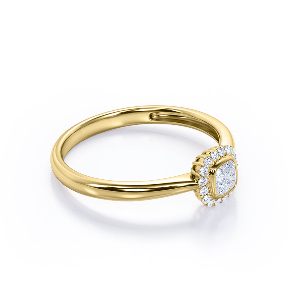 Halo solitaire 0.6 carat Cushion cut Moissanite and diamonds pinched shank engagement ring in yellow gold