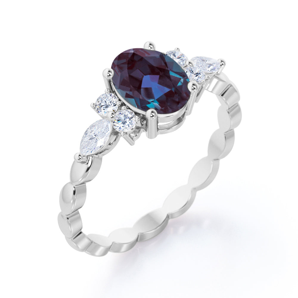 Scalloped bands 1.1 carat Oval cut Lab made Alexandrite and diamond prong style setting engagement ring in White gold
