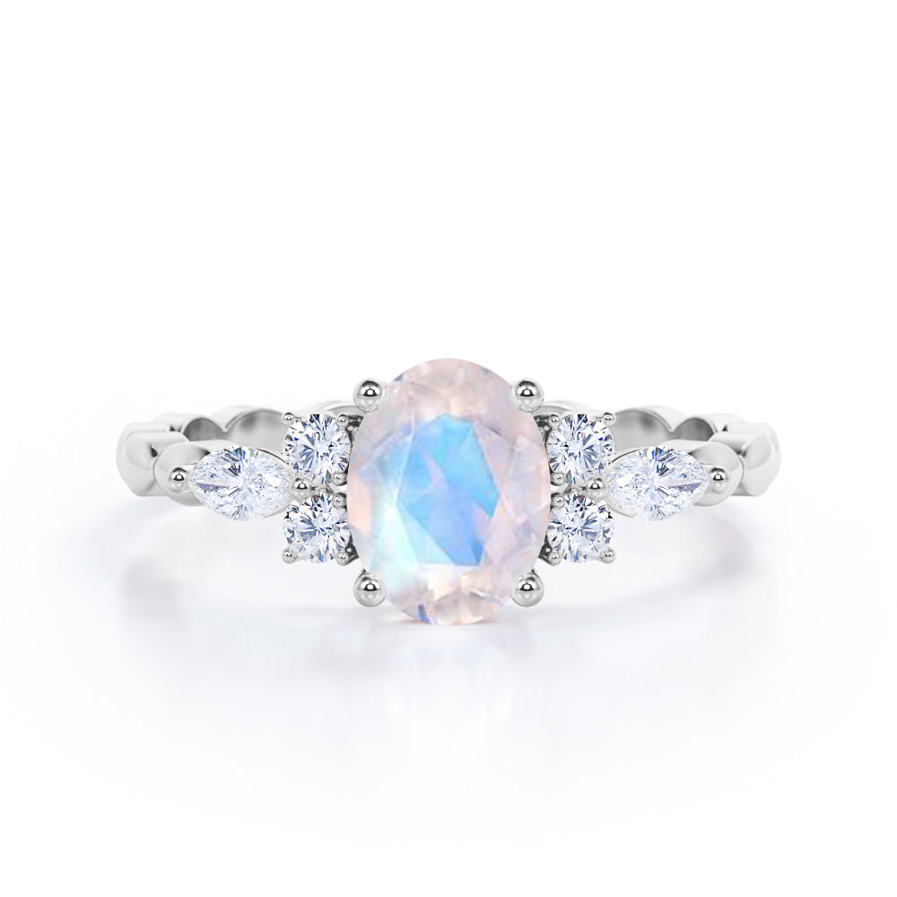 Scalloped Rope Design 1.15 carat Oval cut Moonstone and diamond 7 stone engagement ring in White gold