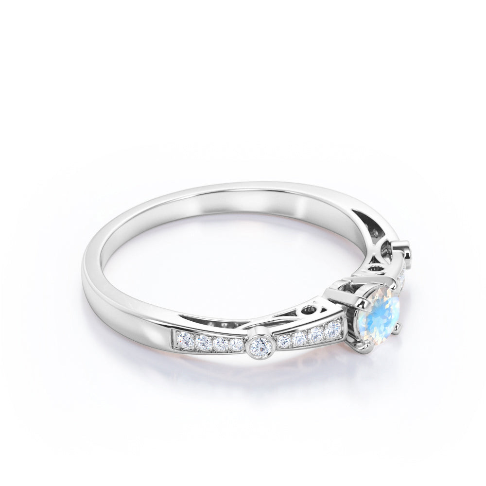 Basket set 1.25 carat Round cut Blue Moonstone and Diamond tapered shank engagement ring in Yellow gold