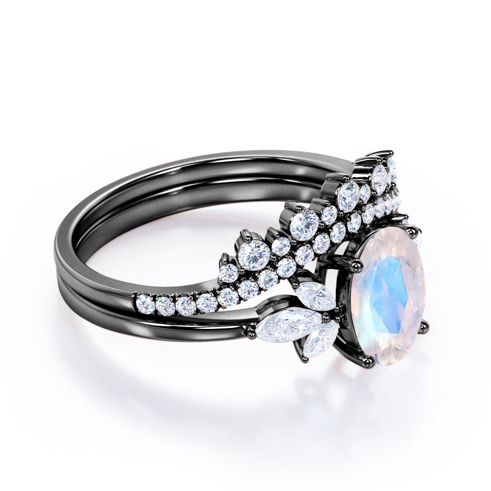 Garland Inspired 1.65 carat Oval shaped Blue Moonstone and diamond contoured seven stone Bridal set in Black gold
