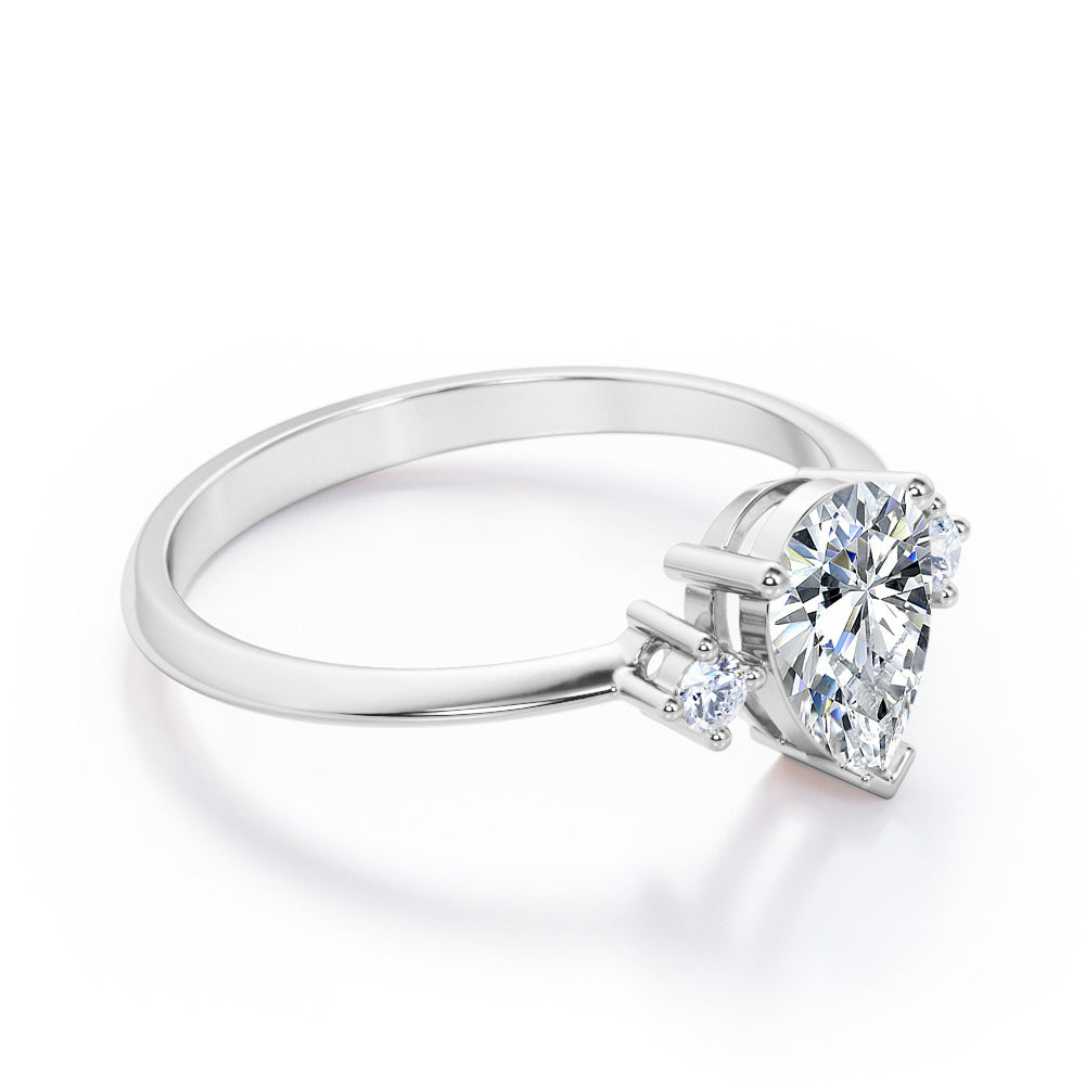 Classic Trinity 1 carat Pear shaped Moissanite and diamond-prong setting-pinched shank engagement ring in White gold