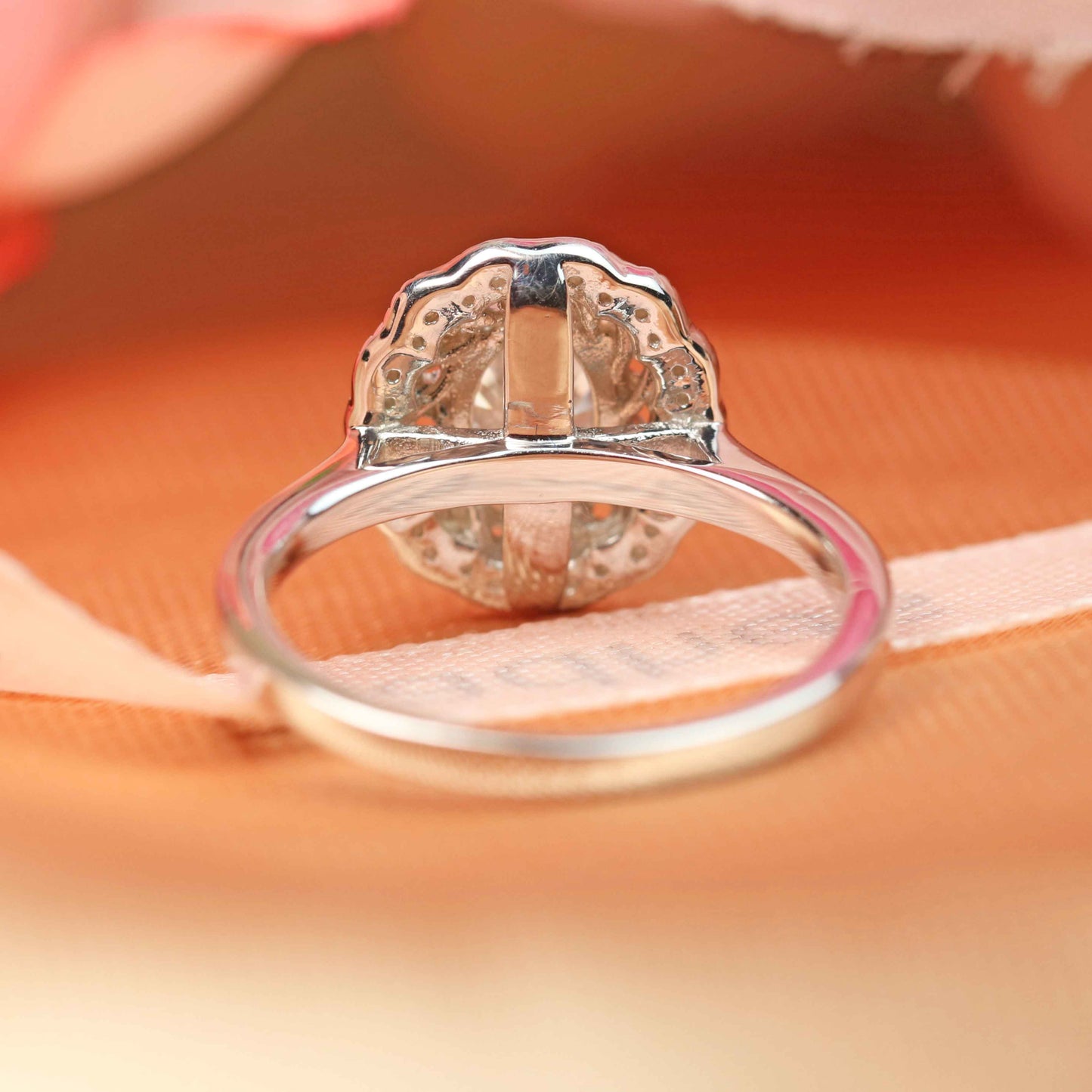 Classic bezel set 1.25 carat Oval cut Moissanite Engagement Ring in White Gold