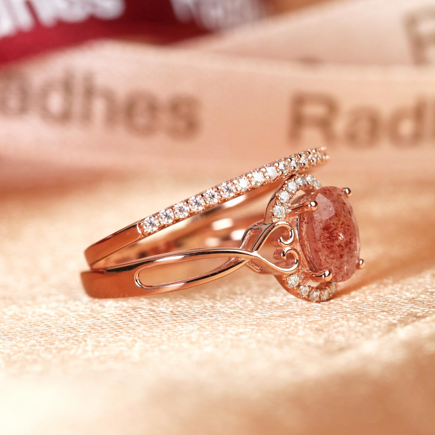 Twisted Heart Shank 1.25 carat Oval Shaped Strawberry Quartz and Diamond Semi-halo Wedding Ring Set for Women with Matching Semi-eternity Wedding Band in Rose Gold