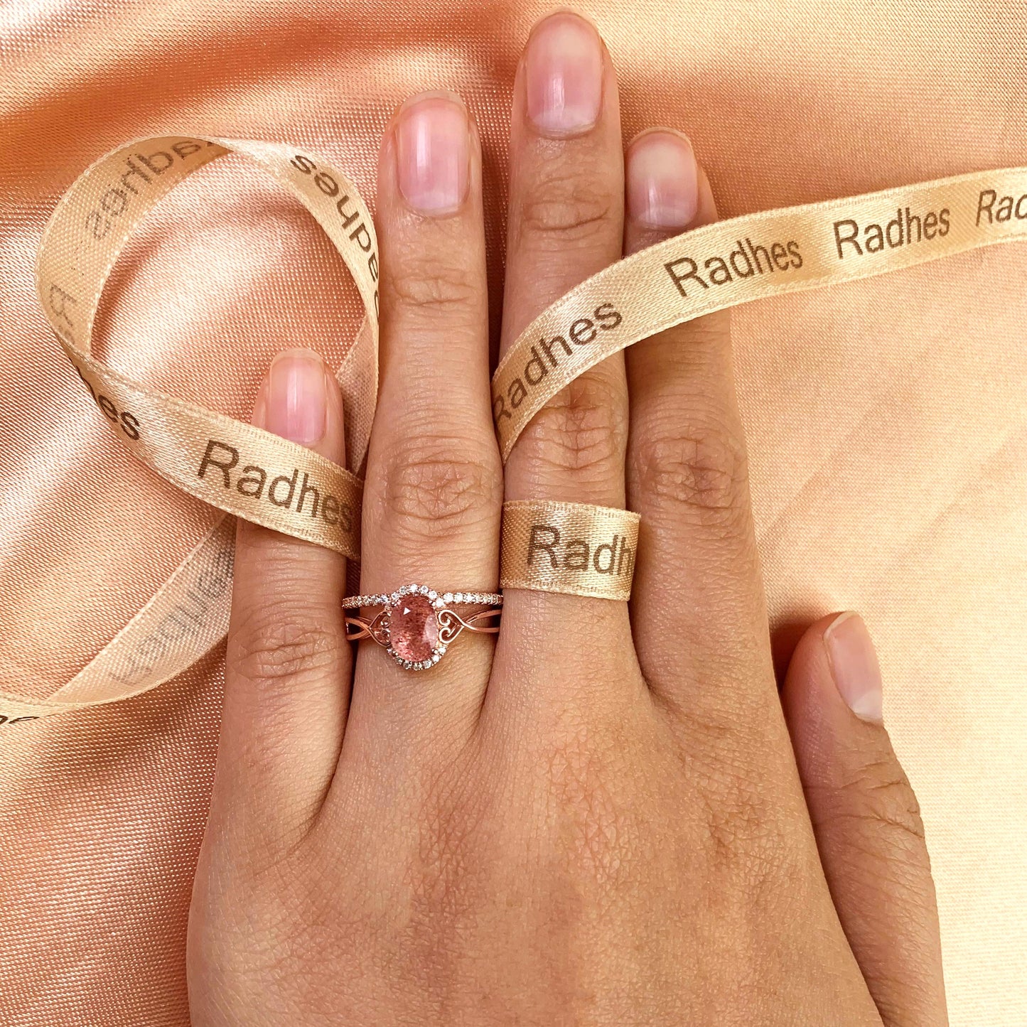Twisted Heart Shank 1.25 carat Oval Shaped Strawberry Quartz and Diamond Semi-halo Wedding Ring Set for Women with Matching Semi-eternity Wedding Band in Rose Gold