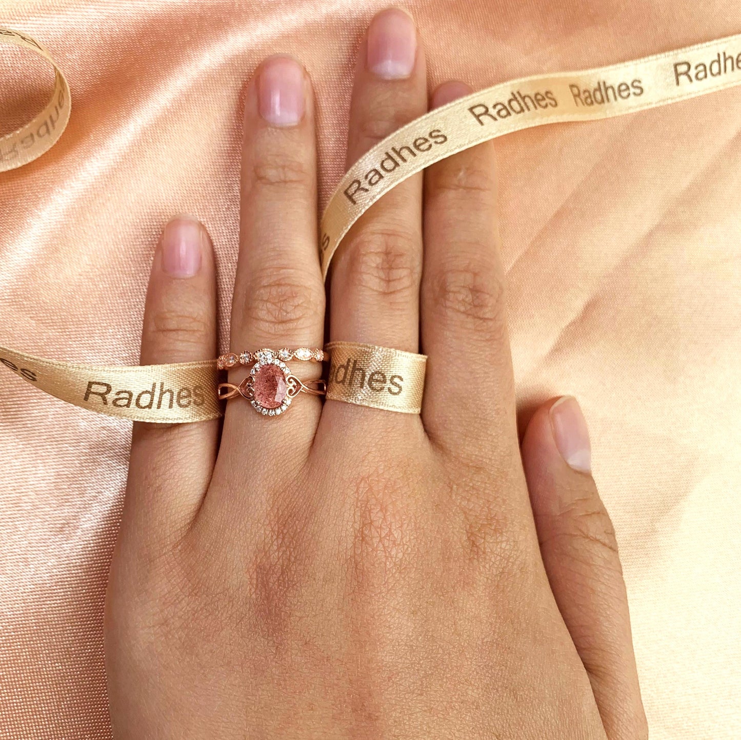 1.5 carat Oval Cut Strawberry Quartz and Diamond Twisted Heart Shank Semi-halo Bridal Ring Set for Women with Matching Milgrain Wedding Band in Rose Gold