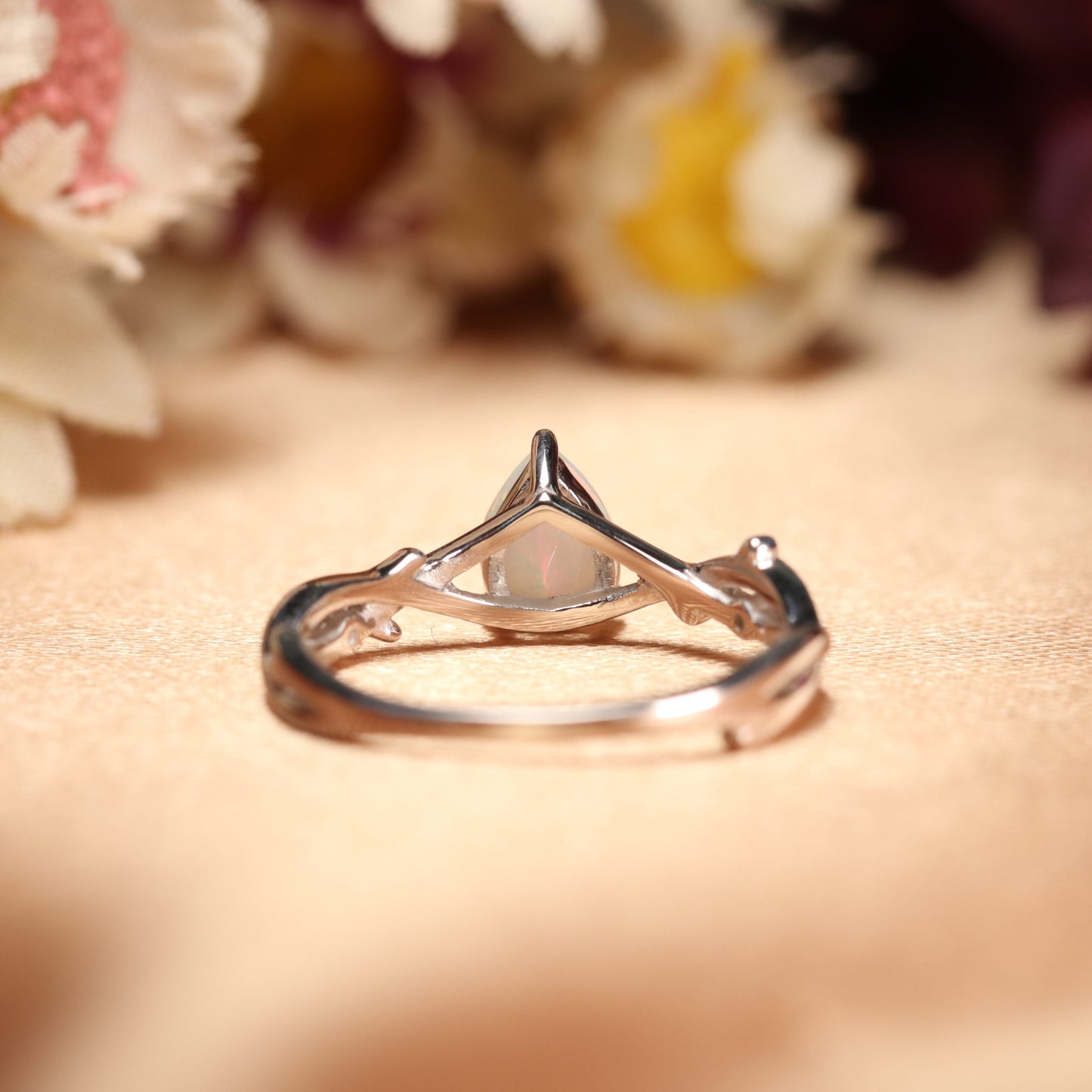 Nature-inspired 1.1 Carat Pear cut Fire Opal Twig Engagement Ring in White Gold