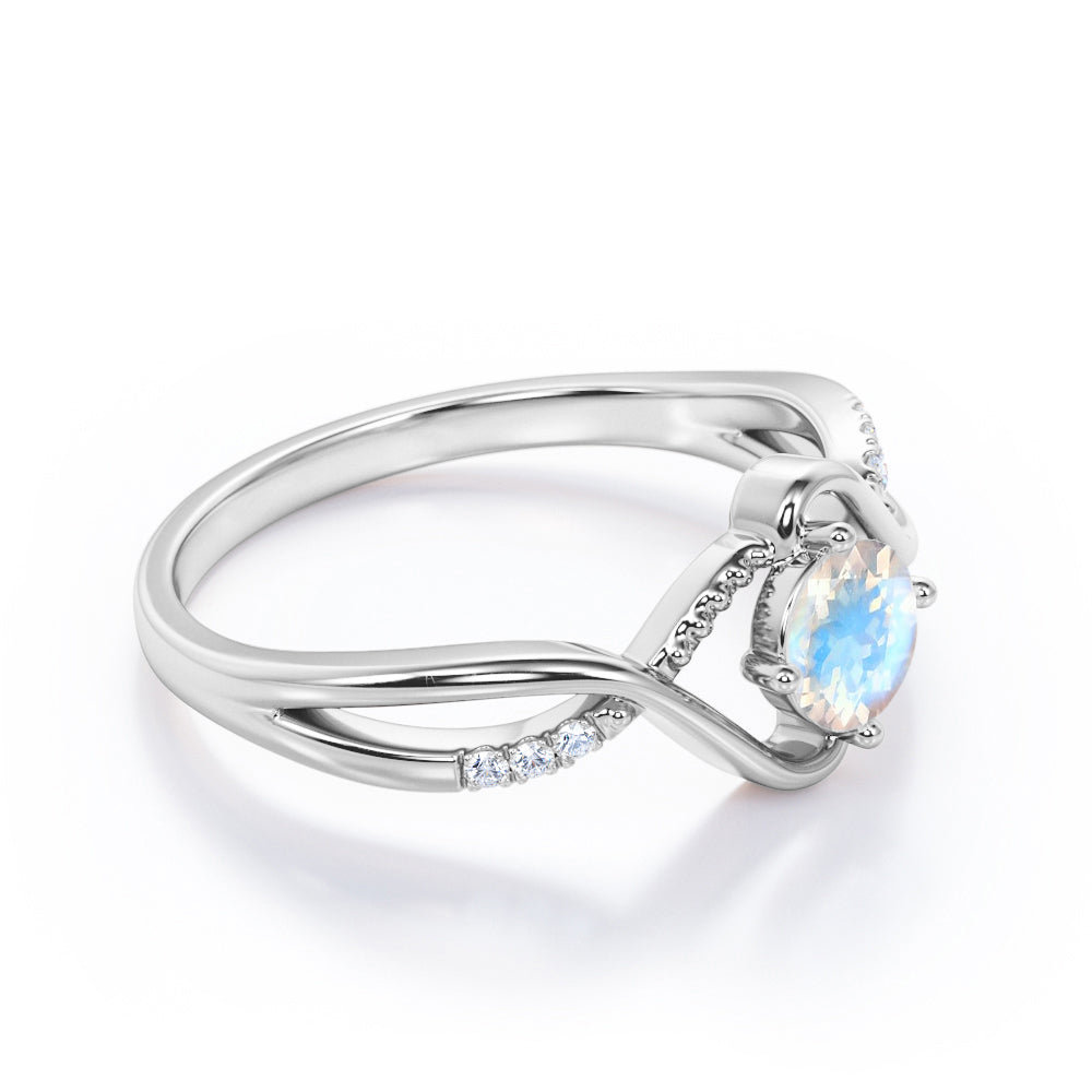 Trendy Twists 0.6 carat Round cut Rainbow Moonstone and diamond infinity pave engagement ring in White gold