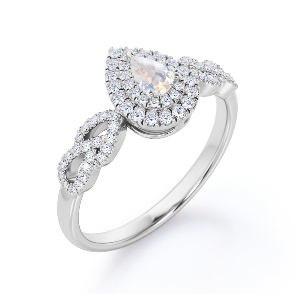 Intertwined 1.7 carat Pear shaped Blue Moonstone and diamond twisted infinity halo engagement ring in White gold