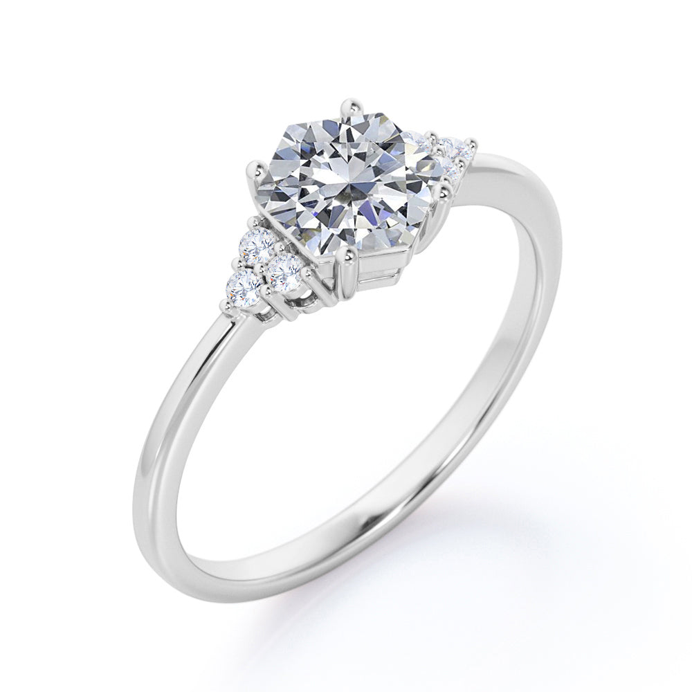 Modern 1 carat Hexagonal Moissanite and diamond tapered knife edge engagement ring in White gold