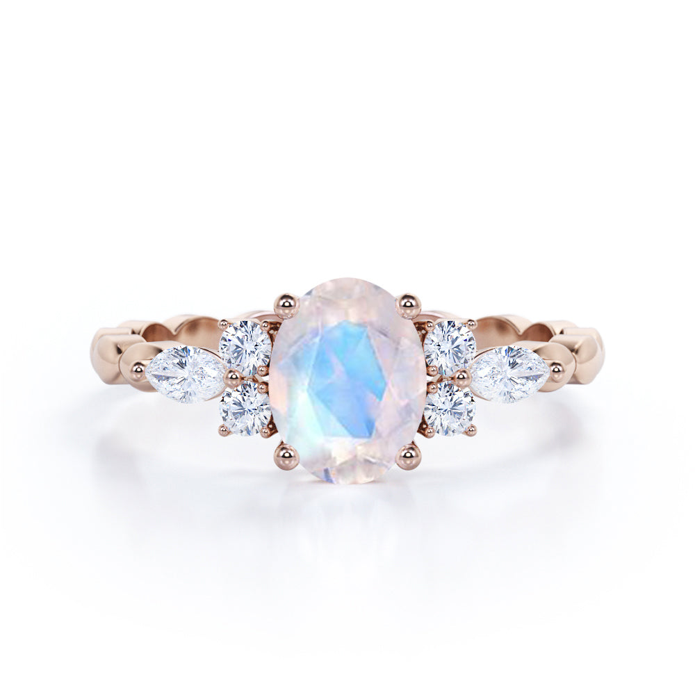 Scalloped Rope Design 1.15 carat Oval cut Moonstone and diamond 7 stone engagement ring in White gold