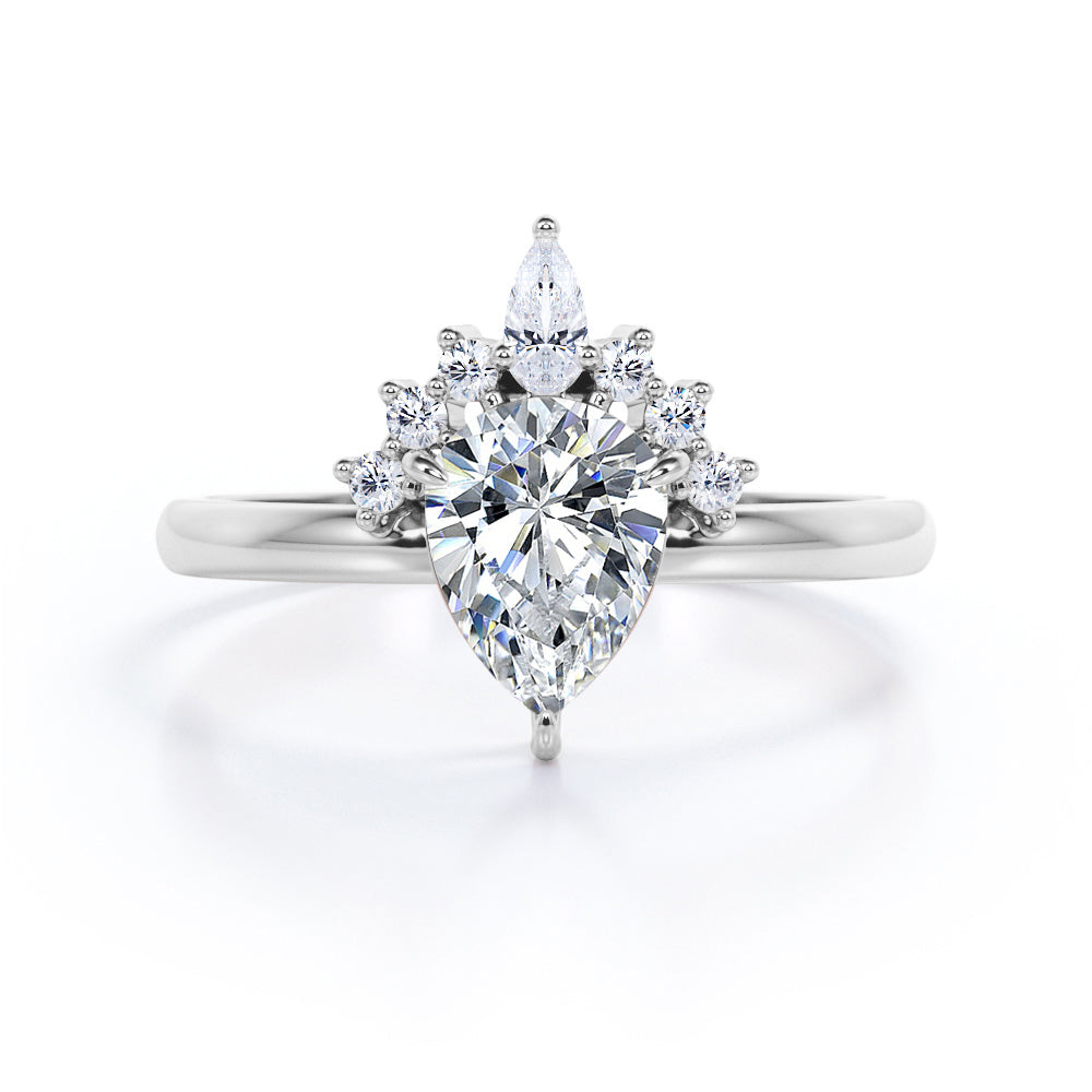 Chevron crown inspired 1.1 carat Pear shaped Moissanite and diamond engagement ring in Rose gold