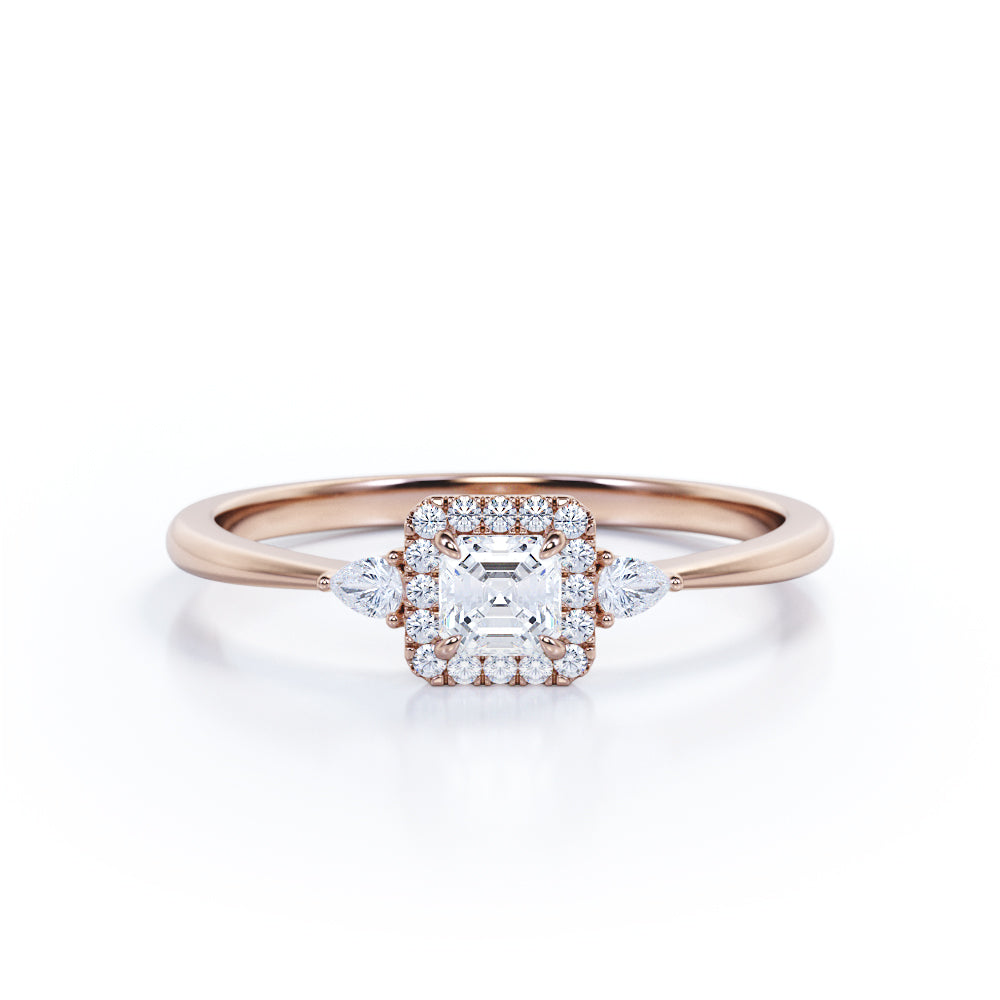 Tapered triple stone 0.7 carat Round cut Moissanite and diamond halo engagement ring in White gold