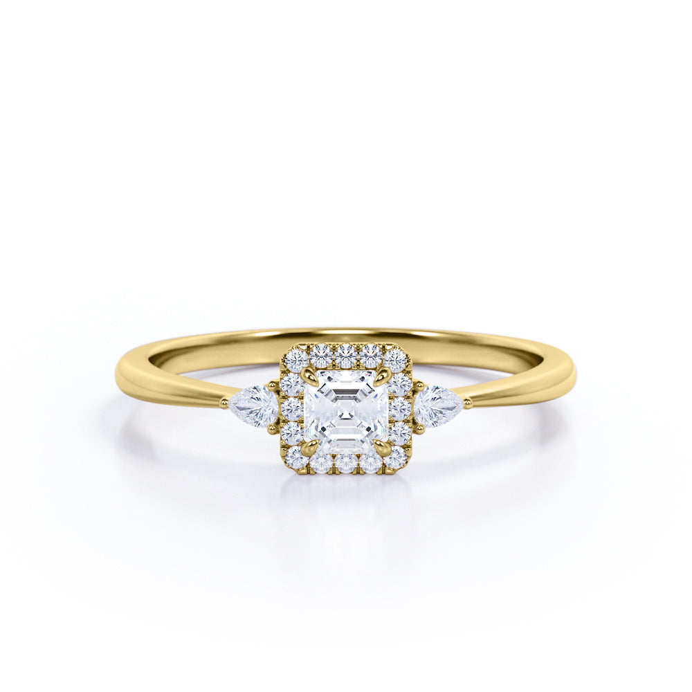Tapered triple stone 0.7 carat Round cut Moissanite and diamond halo engagement ring in White gold