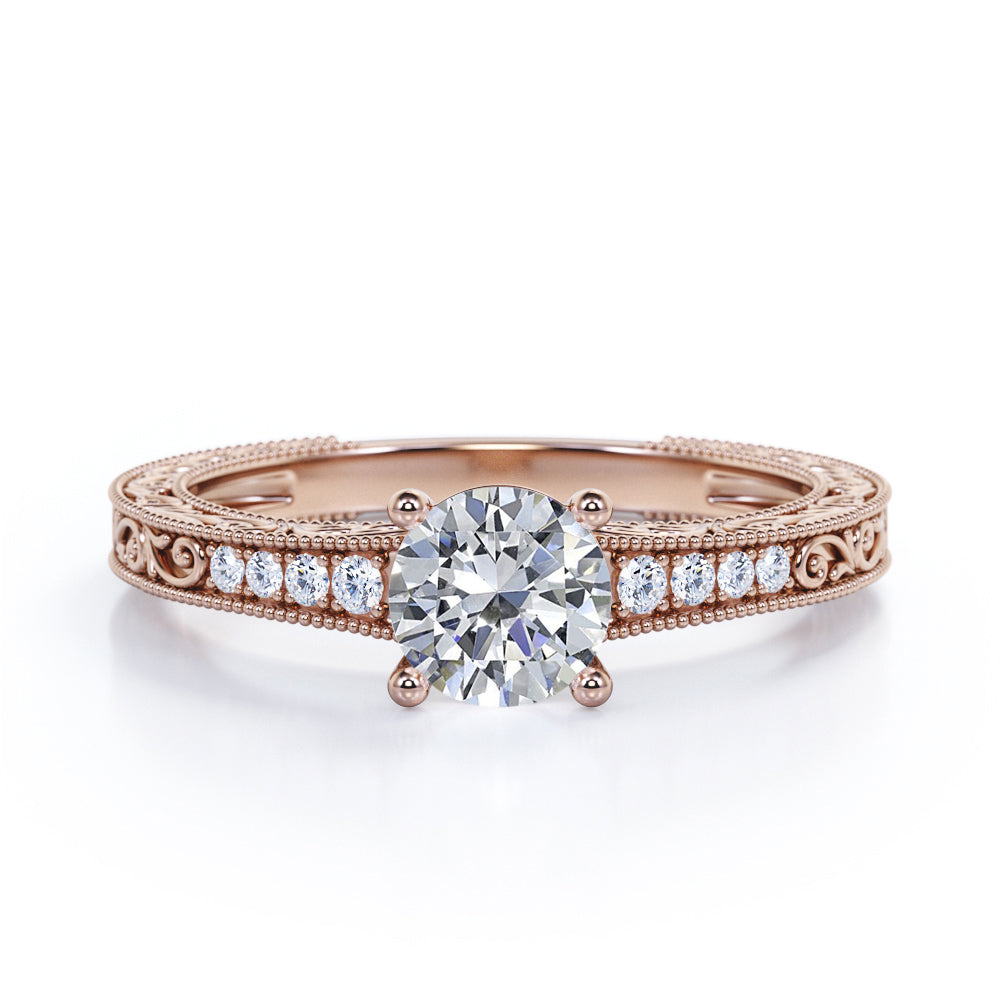 Artistic filigree 1.1 carat Moissanite and diamond low-basket setting engagement ring in White gold