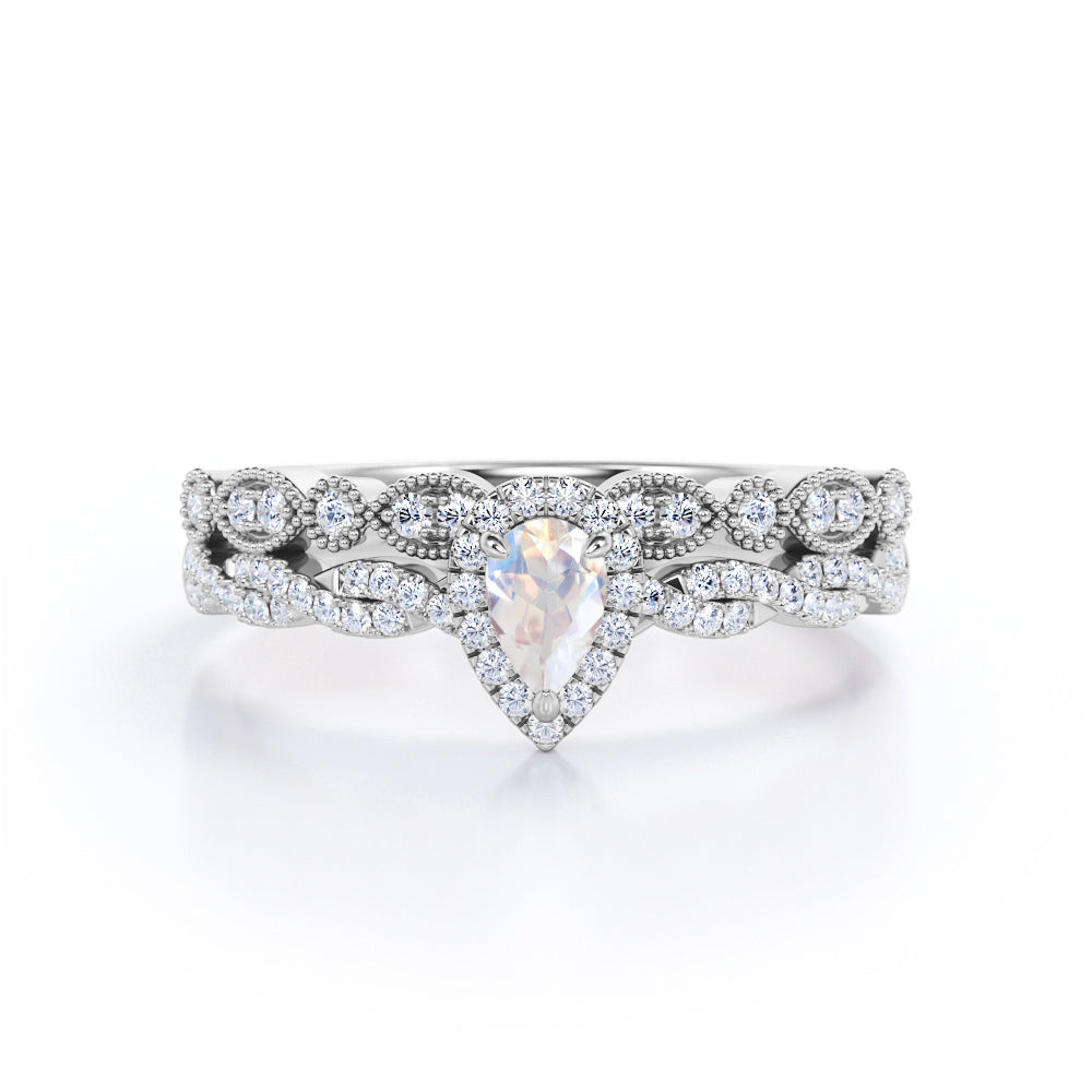 Art deco Milgrain 1.65 carat Pear cut Moonstone and diamond twisted pave engagement ring in yellow gold