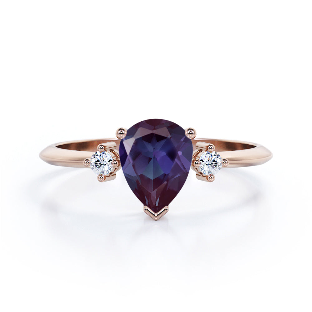 Classic three stone 1.1 carat Pear shaped Alexandrite and diamond pinched shank engagement ring for women in Black gold