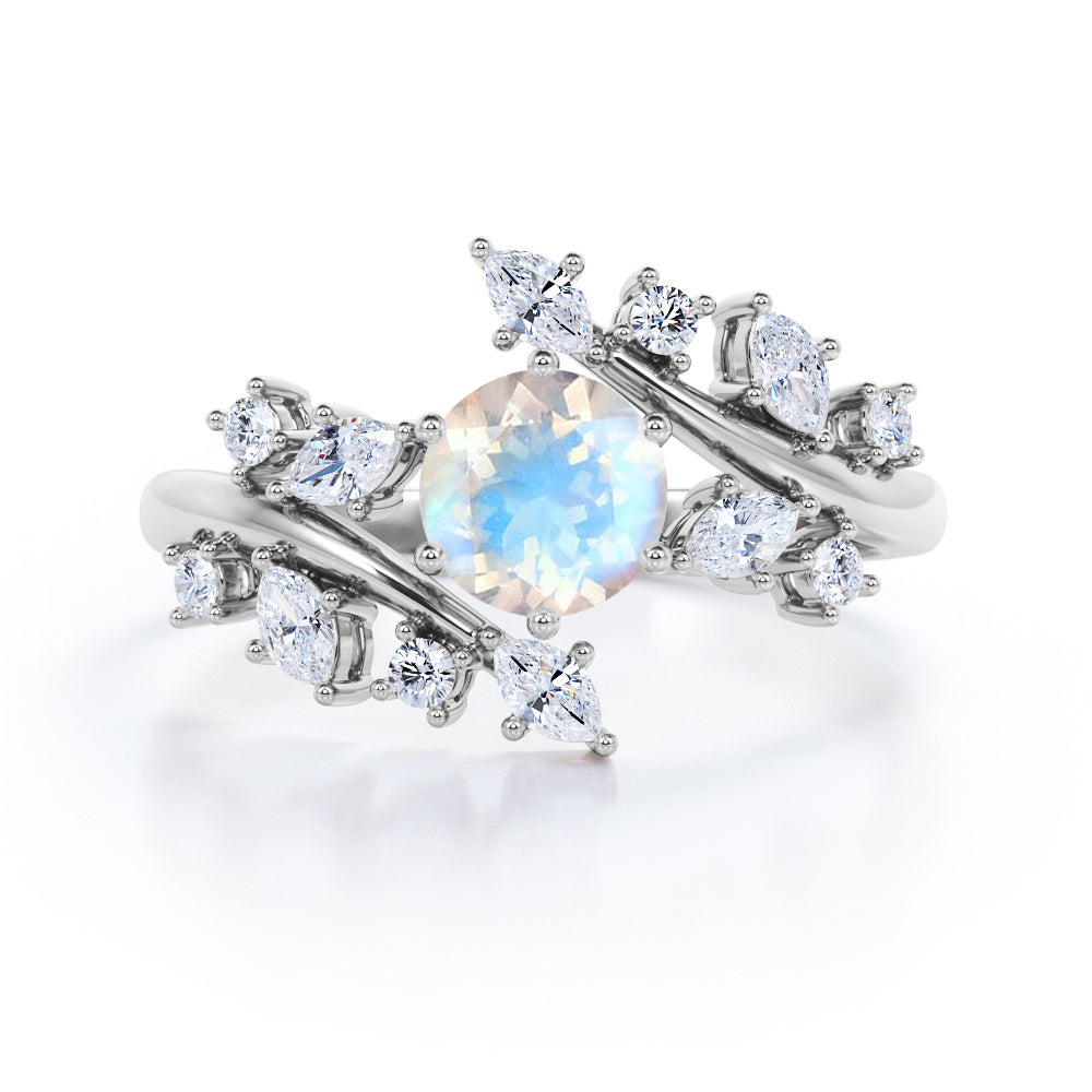 Floral Branch and leaf 1.25 carat Round cut Blue Moonstone and diamond tension set engagement ring in Black gold