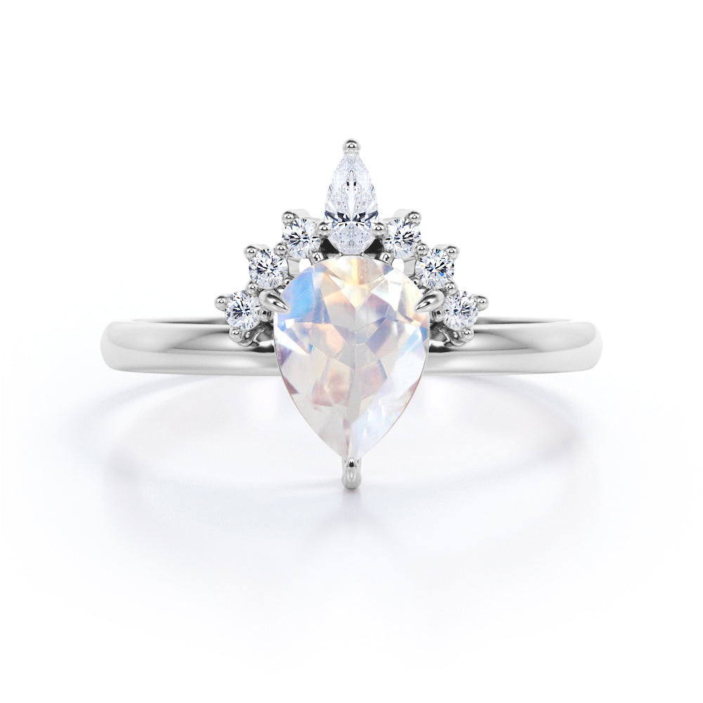 Crown Tiara inspired 1.2 carat Pear cut Rainbow Moonstone and diamond prong style engagement ring in Rose gold