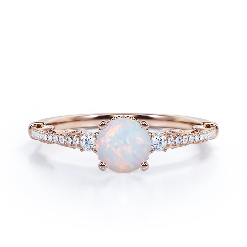 Artistic 3 stone 1.30 carat Round cut Ethiopian Opal and diamond antique art deco engagement ring in Black gold