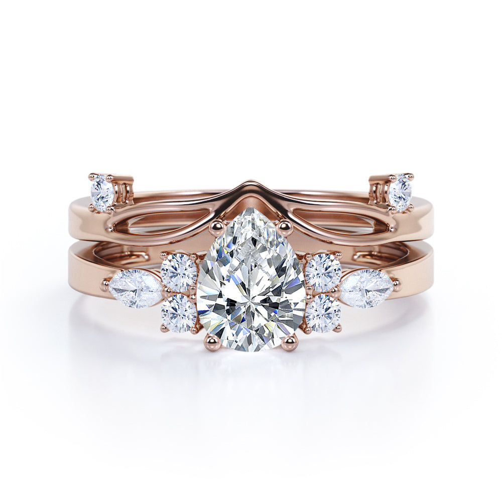Split shank Chevron 1.2 carat tear drop shaped Moissanite and diamond art deco style engagement ring in Black gold