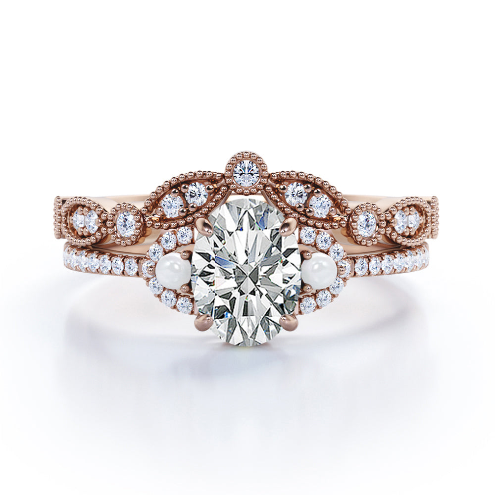 Artistic art deco inspired 1.5 carat Oval shaped Moissanite, diamonds and pearls milgrain wedding ring set for women in Black gold