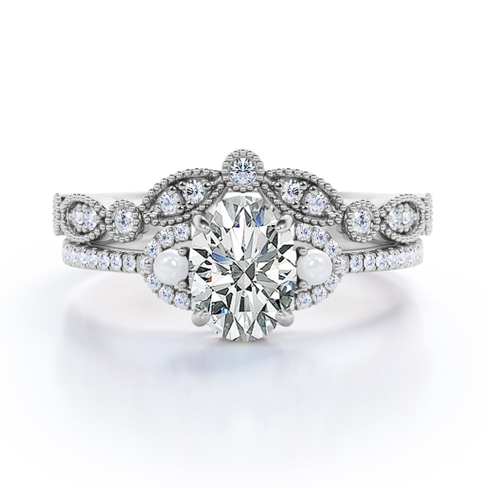 Artistic art deco inspired 1.5 carat Oval shaped Moissanite, diamonds and pearls milgrain wedding ring set for women in Black gold