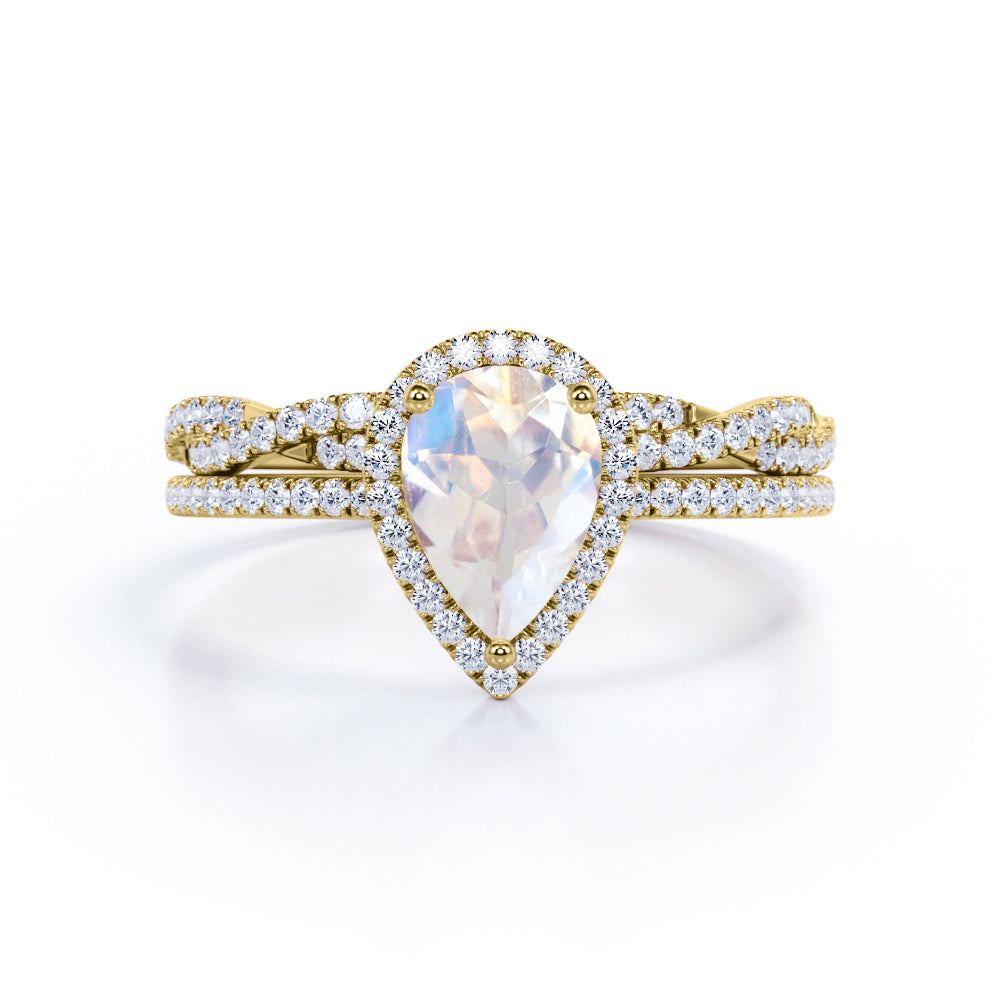 Exquisite 1.75 carat Pear cut Rainbow Moonstone Engagement ring with matching half eternity wedding ring band in gold