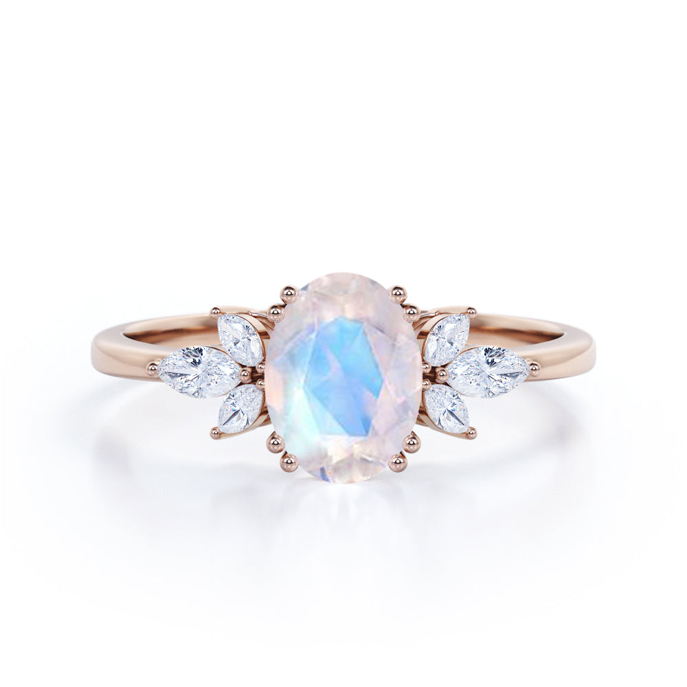 Floral inspired 1.25 carat Oval cut Rainbow Moonstone and marquise diamond double prong engagement ring in Black gold