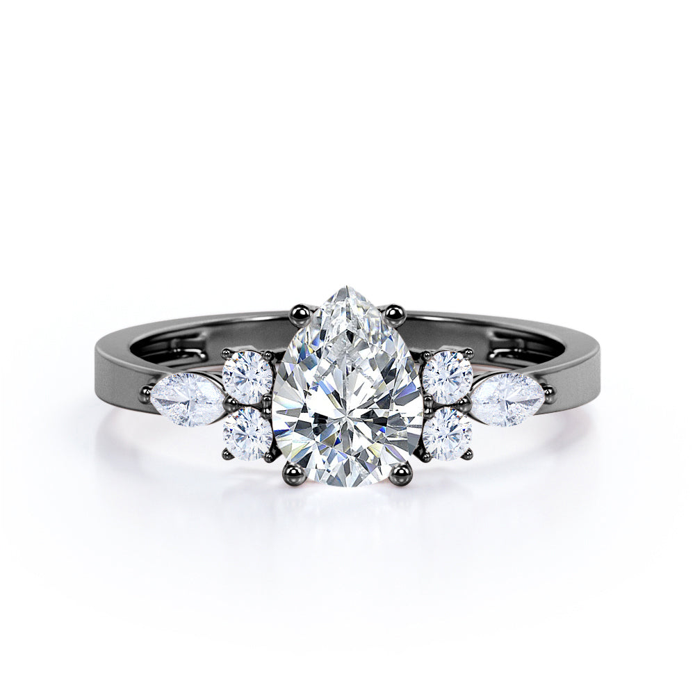 Elegant Beveled Edge 1.15 carat Pear cut Moissanite and diamond engagement ring in White gold