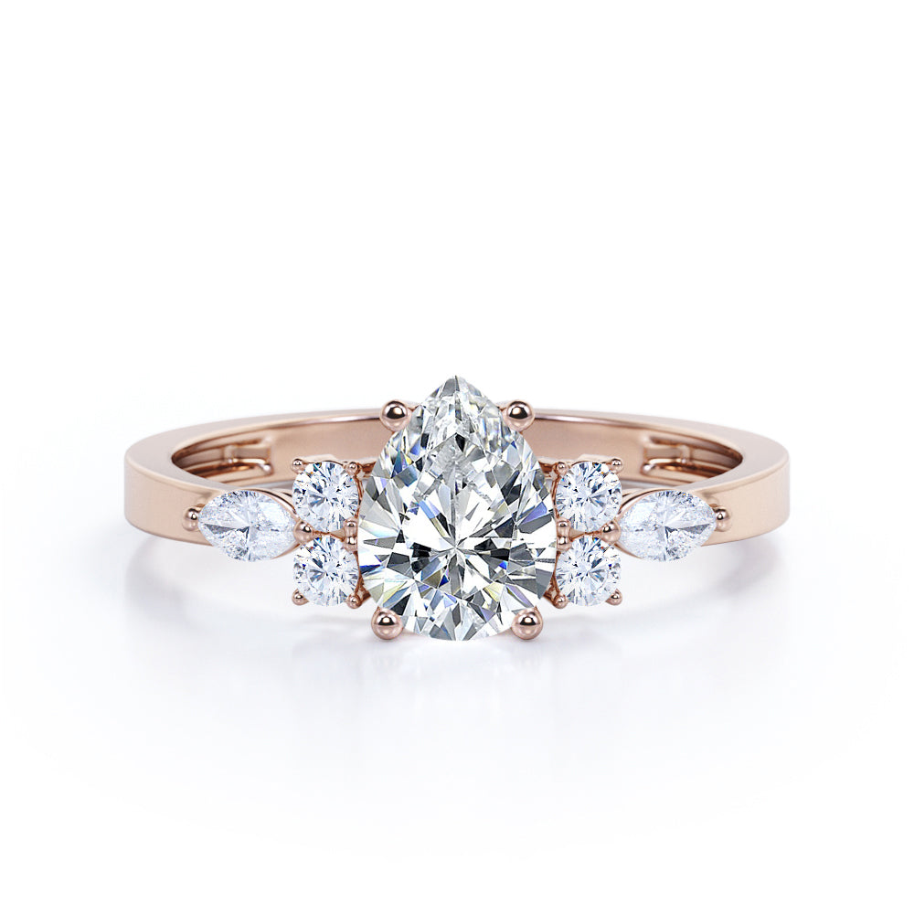Elegant Beveled Edge 1.15 carat Pear cut Moissanite and diamond engagement ring in White gold