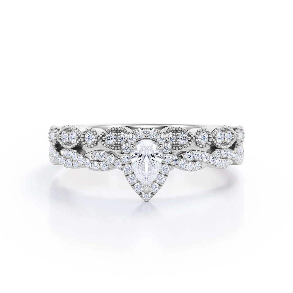 Vintage infinity 1.25 carat Pear shaped Moissanite and diamond milgrain and halo Bridal set in Rose gold