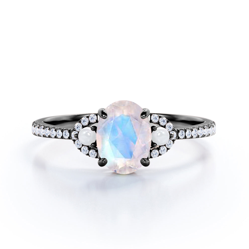Pretty Pearls 1.5 carat Oval cut Moonstone and diamond traditional engagement ring in White gold