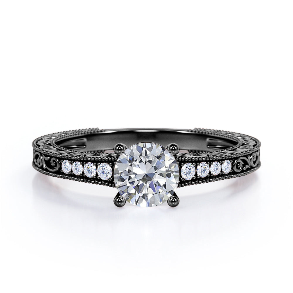 Artistic filigree 1.1 carat Moissanite and diamond low-basket setting engagement ring in White gold