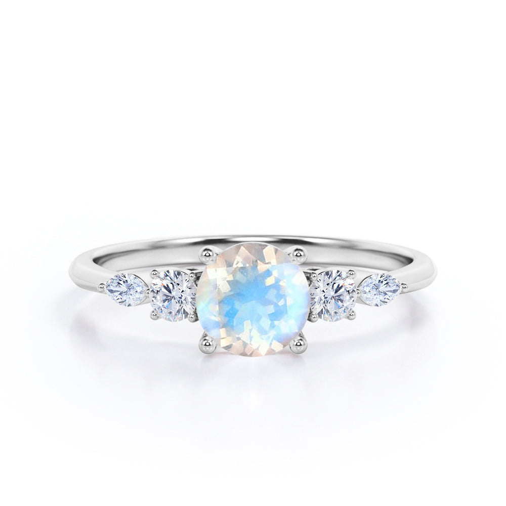 Artistic Five stone 1.1 carat Round cut Moonstone and diamond pinched shank engagement ring in Black gold